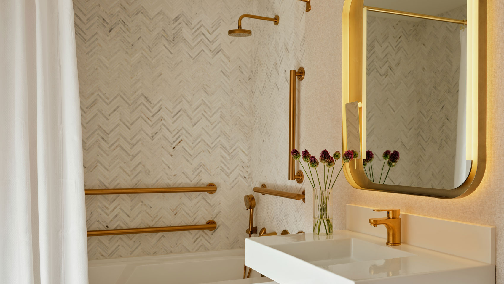 Bathroom sink and tub at Kimpton Ashbel Hotel